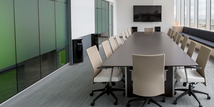 Empty board room with chairs and a TV